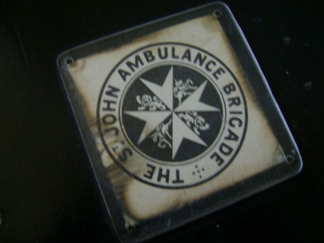 Badge on wood Ambulance First Aid Box-c1950s.jpg