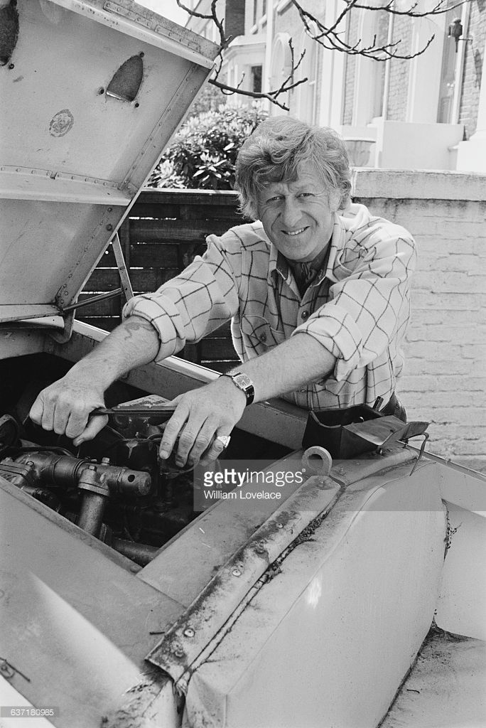 english-actor-jon-pertwee-working-on-a-speedboat-at-his-home-in-uk-picture-id637180985.jpg